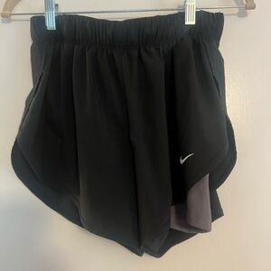 Women’s Nike athletic shorts with built in shorts. Size medium. Black and gray.